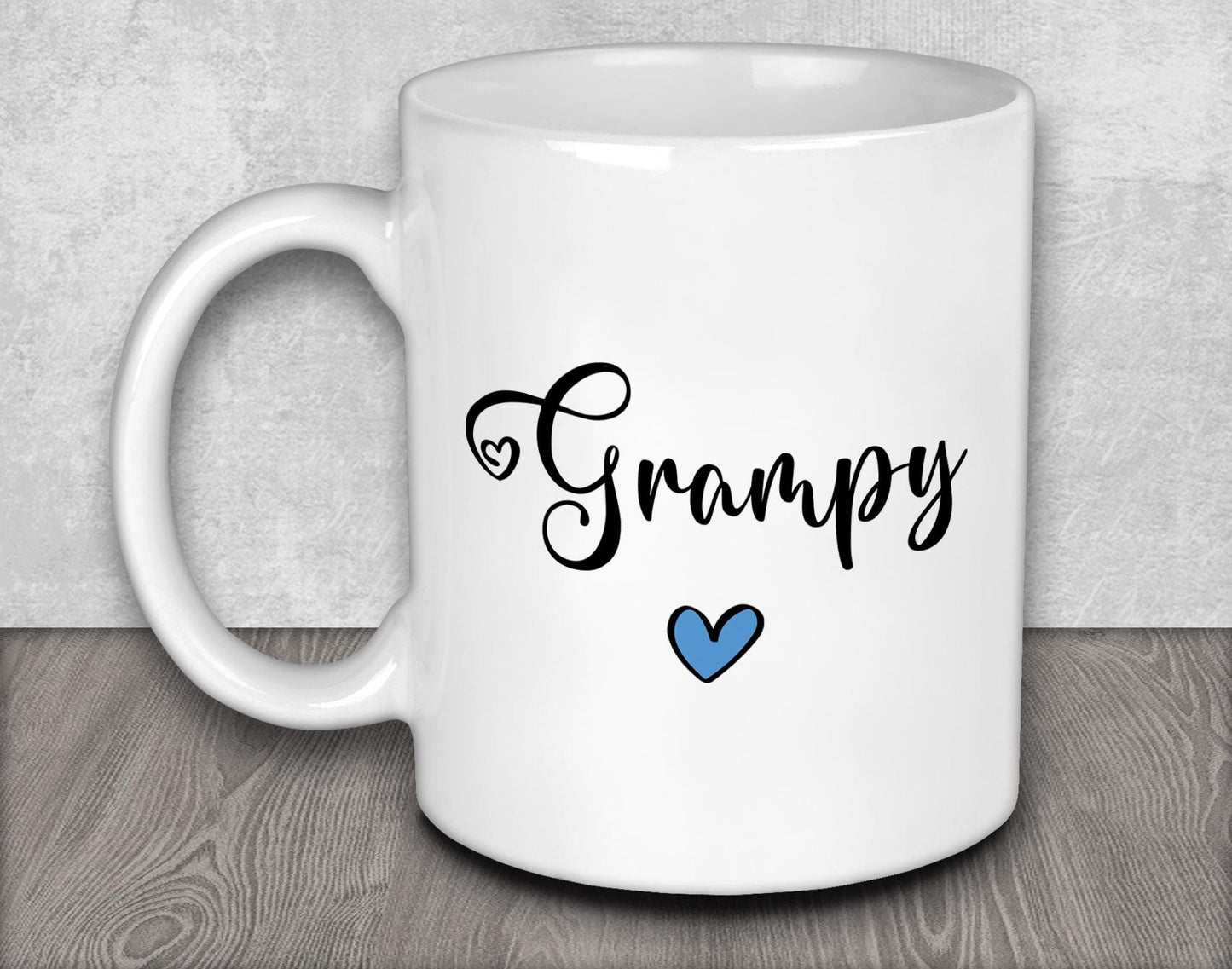 a white coffee mug with a blue heart on it