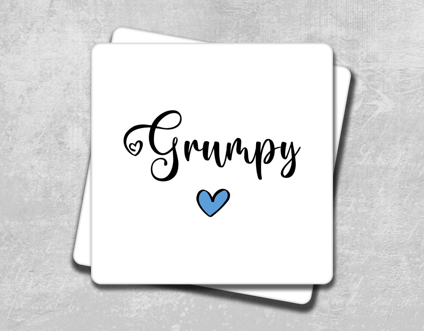 a white card with the word's name and a blue heart on it