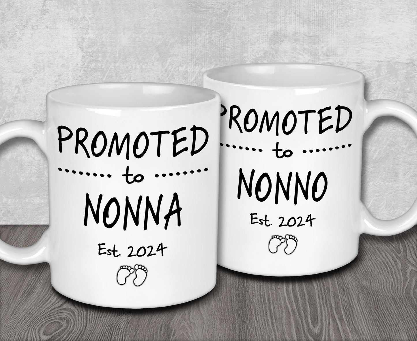 two white coffee mugs sitting on top of a wooden table