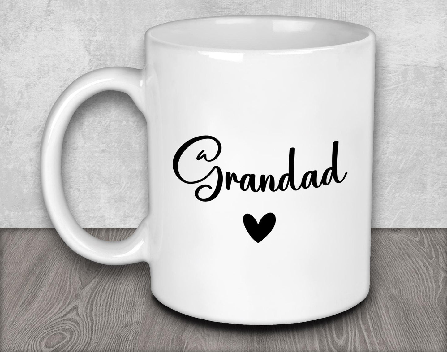 a white coffee mug with a black heart on it