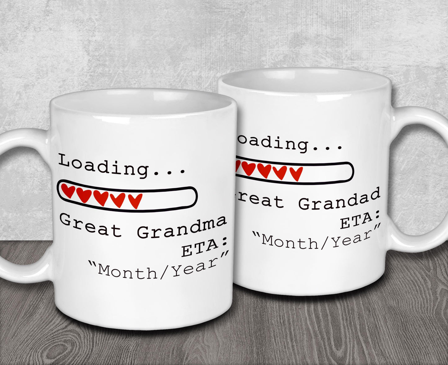 two white coffee mugs sitting on top of a wooden table