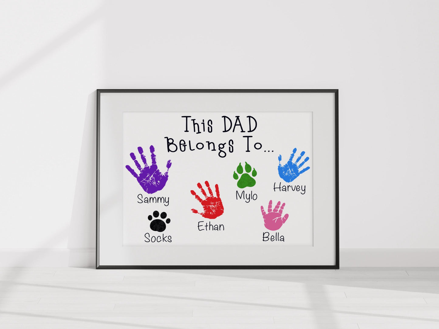 a picture of a picture of a hand print with the words, this dad belongs