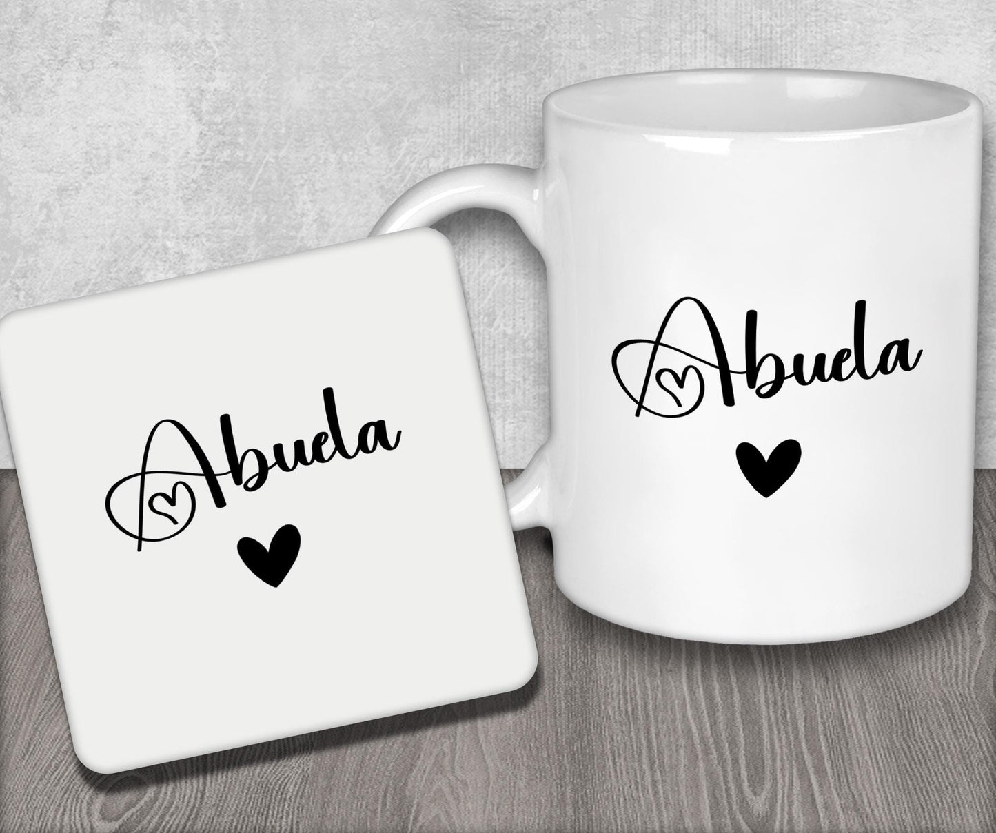 a couple of white coffee mugs sitting on top of a wooden table