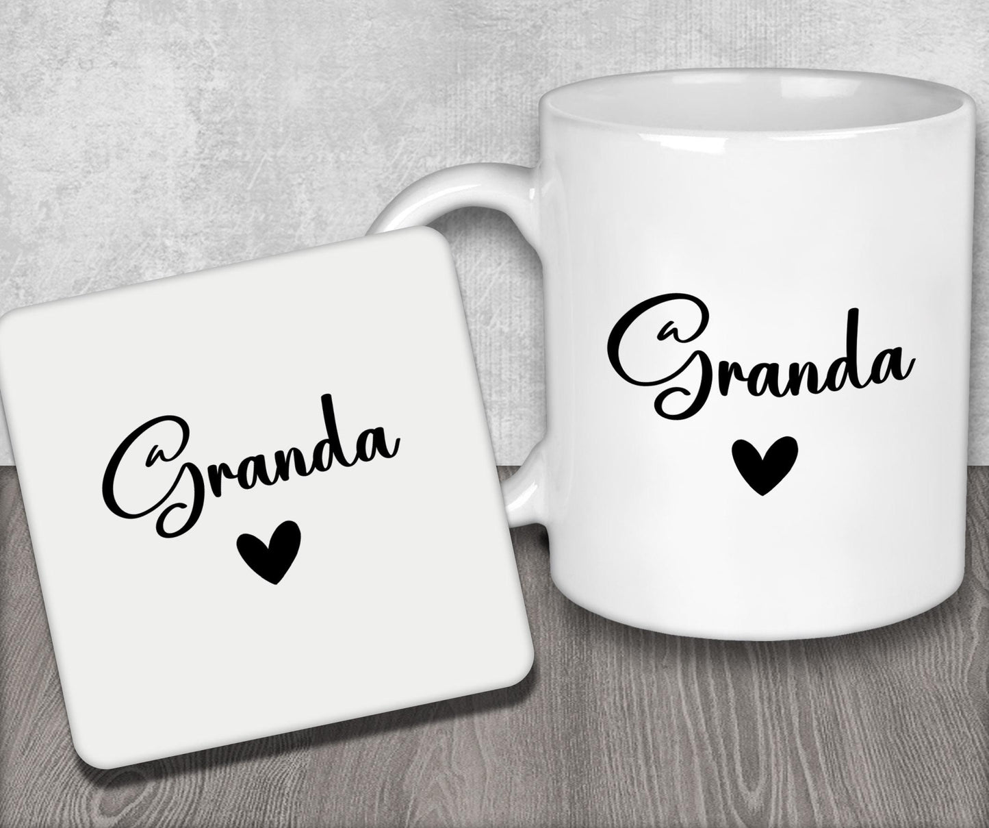 a couple of white coffee mugs sitting on top of a wooden table