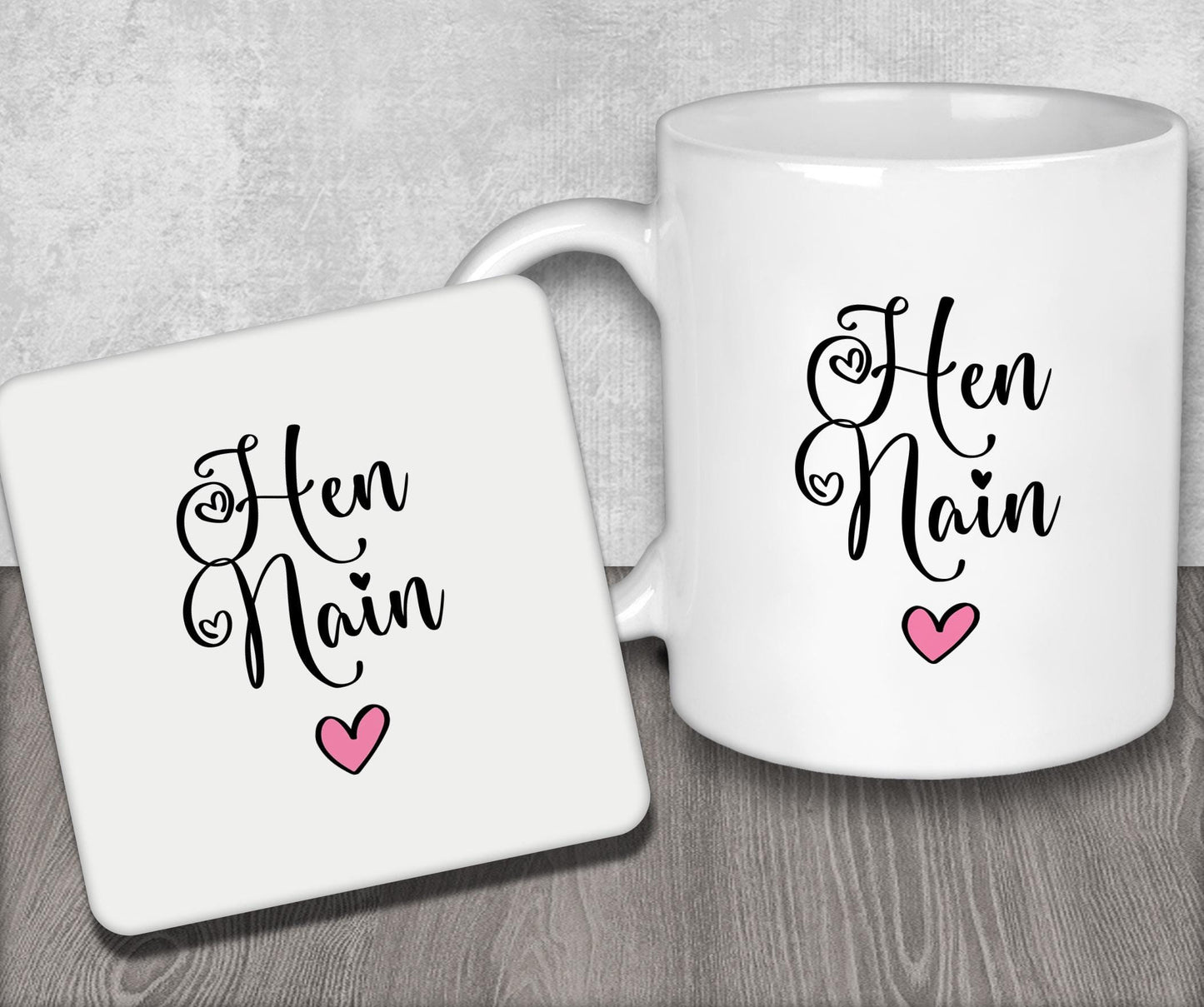 a couple of coffee mugs sitting on top of a wooden table