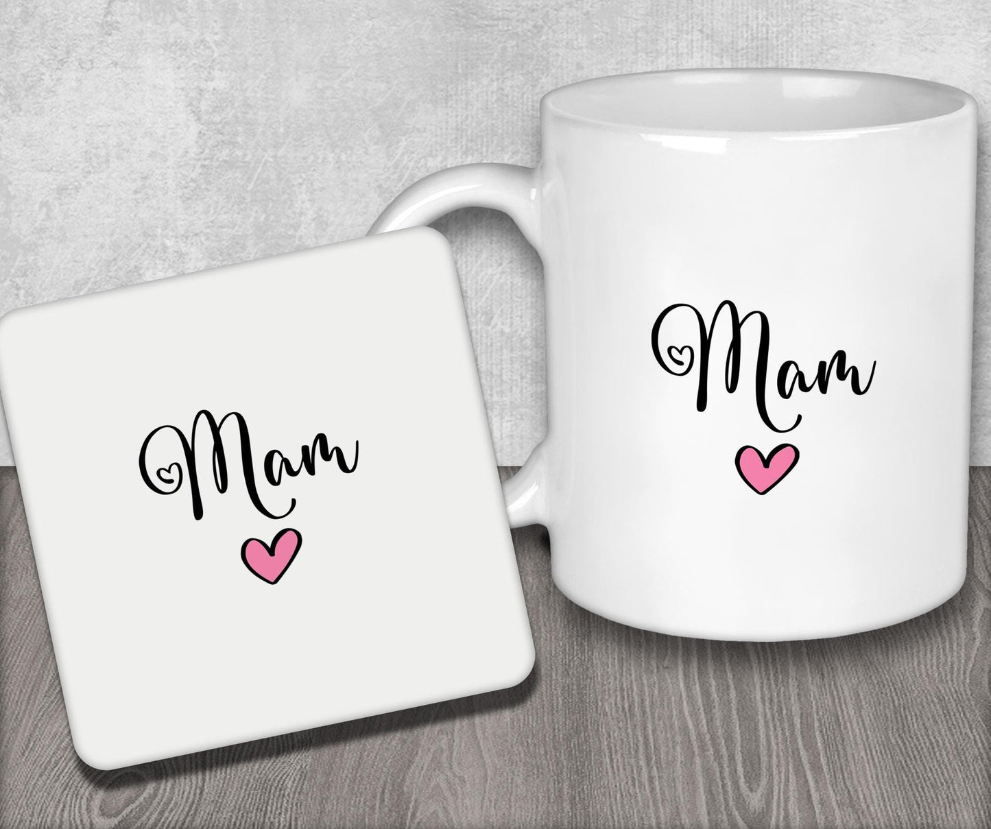 a white coffee mug with the word mom on it