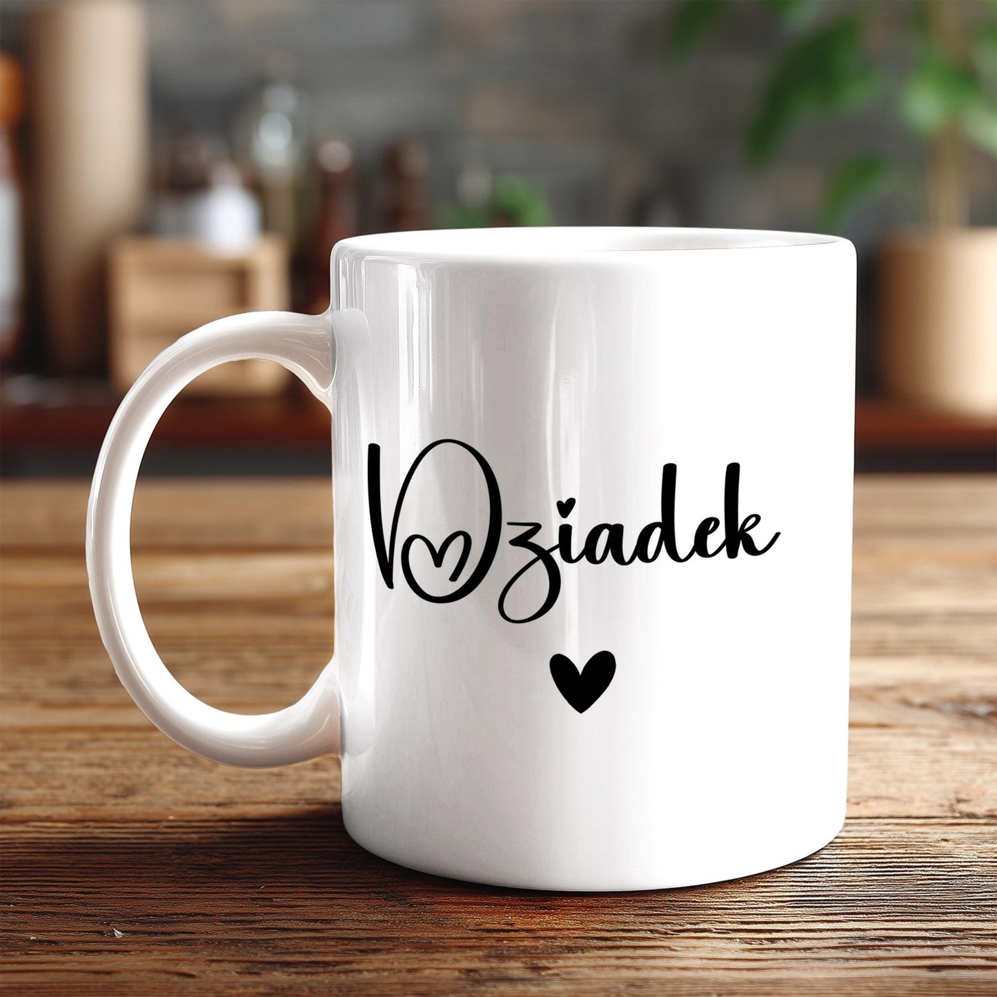 A white ceramic mug with the text "V Świadcześk" (Vzwiał) and a heart symbol printed on it, placed on a wooden surface.