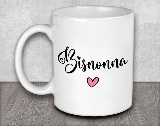 a white coffee mug with a pink heart on it