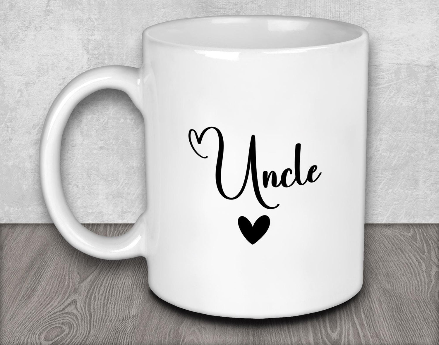 a white coffee mug with the word uncle on it