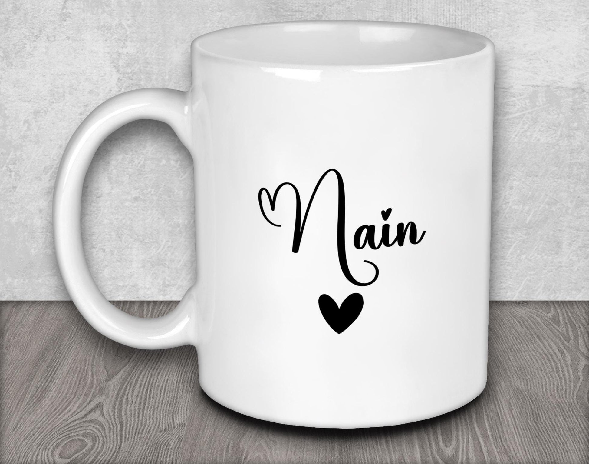 a white coffee mug with the word main on it