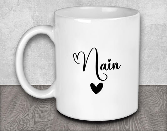 a white coffee mug with the word main on it