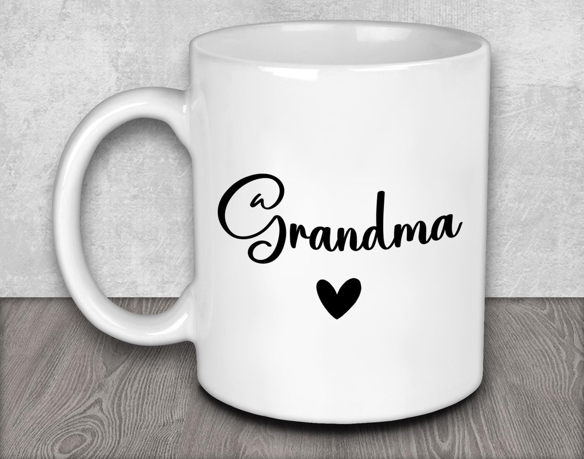 a white coffee mug with the word grandma on it