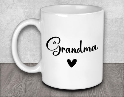a white coffee mug with the word grandma on it