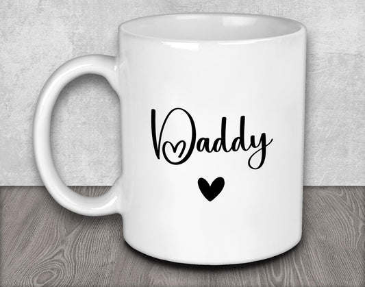 a white coffee mug with the word daddy on it