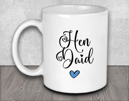 a white coffee mug with the words hen and dad on it