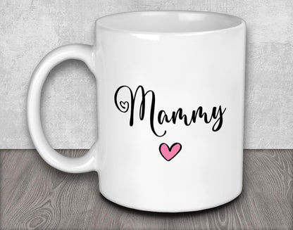 a white coffee mug with a pink heart on it