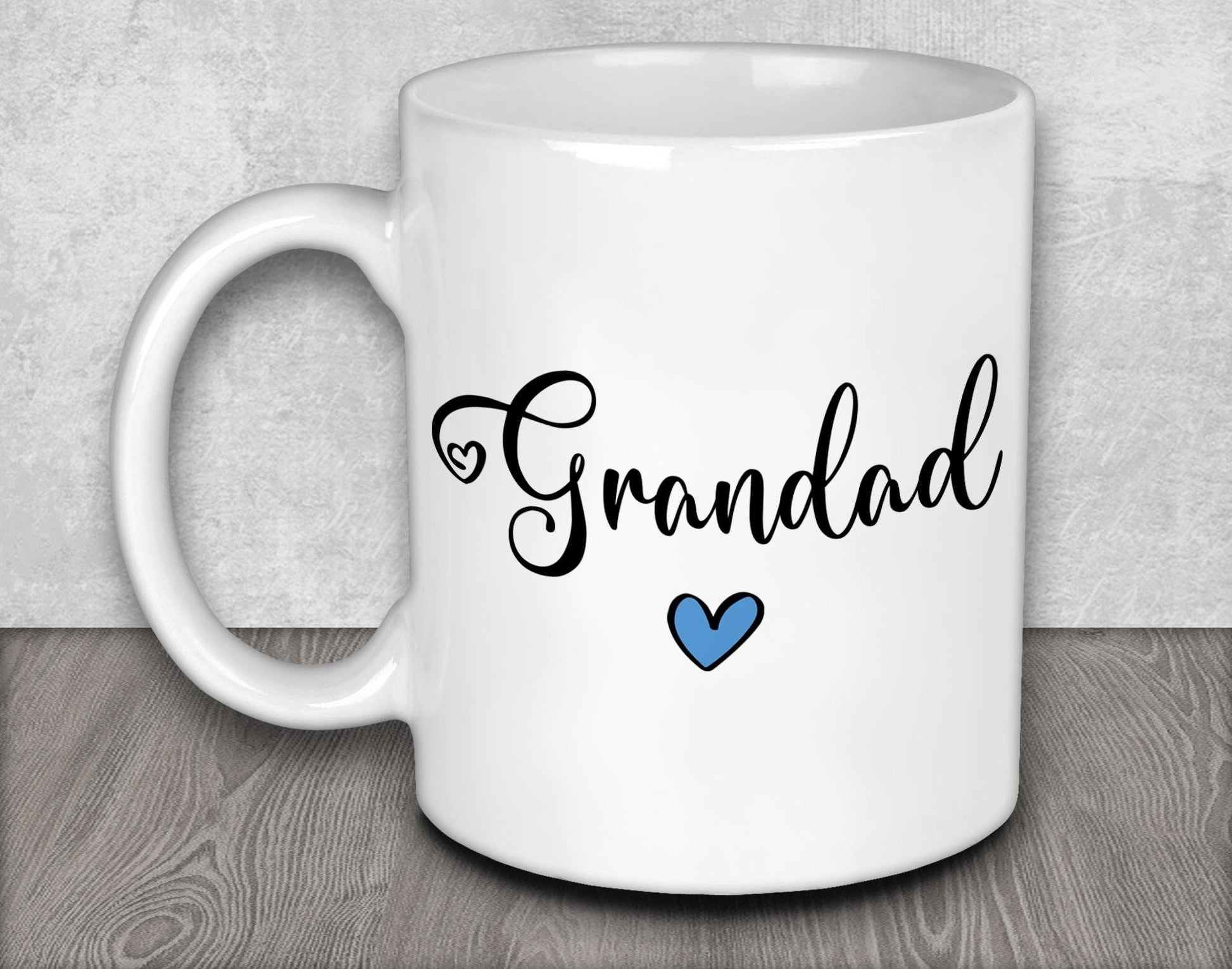 a white coffee mug with a blue heart on it