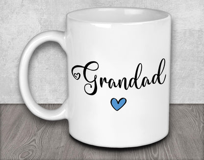 a white coffee mug with a blue heart on it