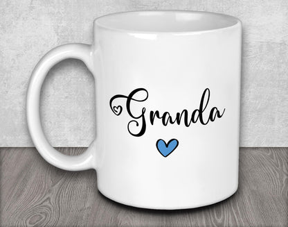 a white coffee mug with a blue heart on it