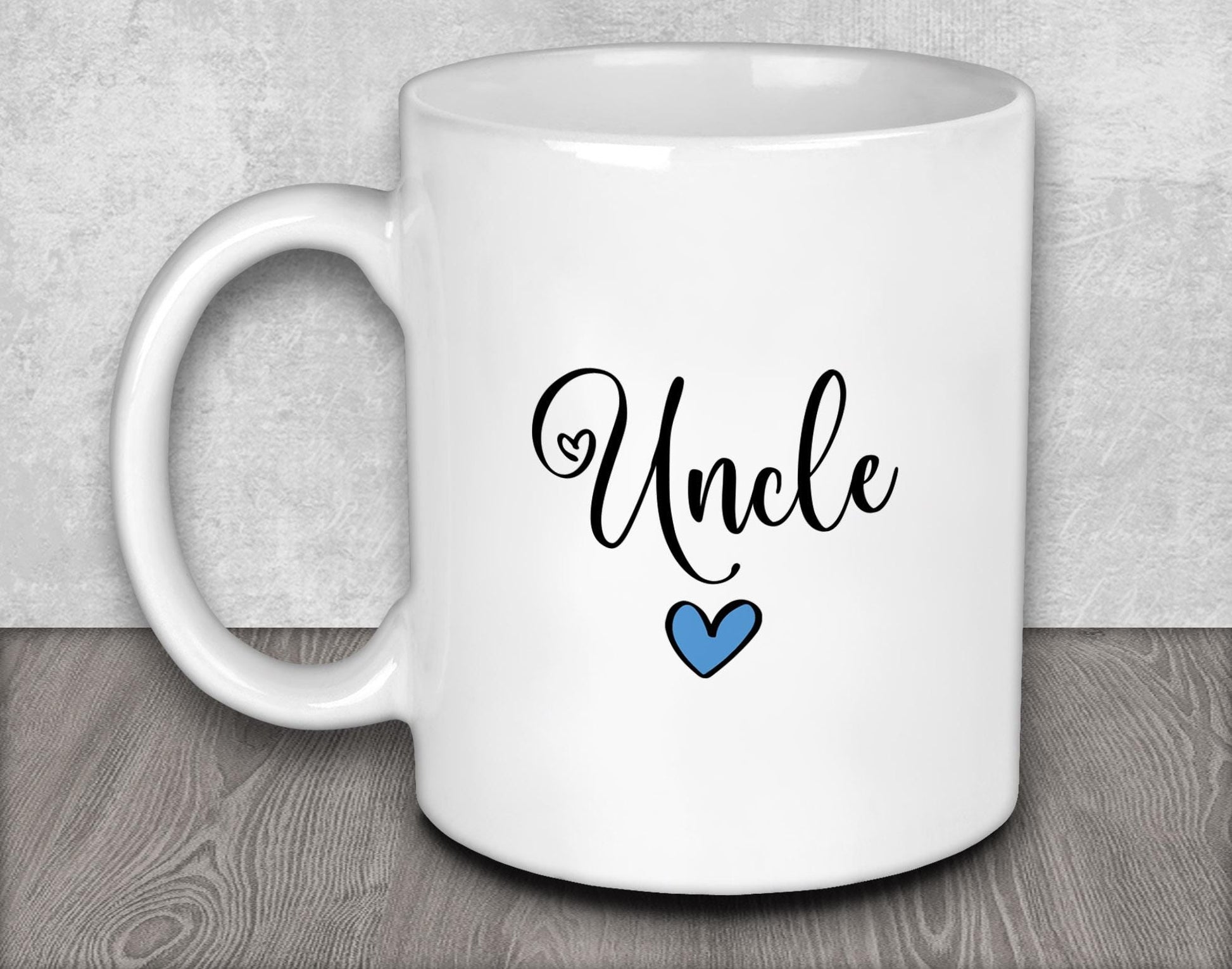 a white coffee mug with the word uncle on it