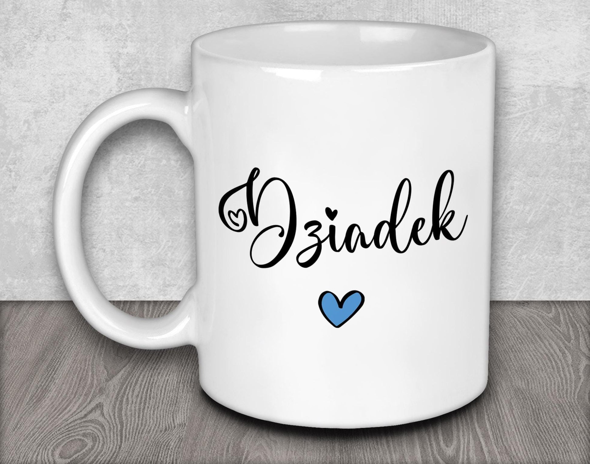 a white coffee mug with a blue heart on it