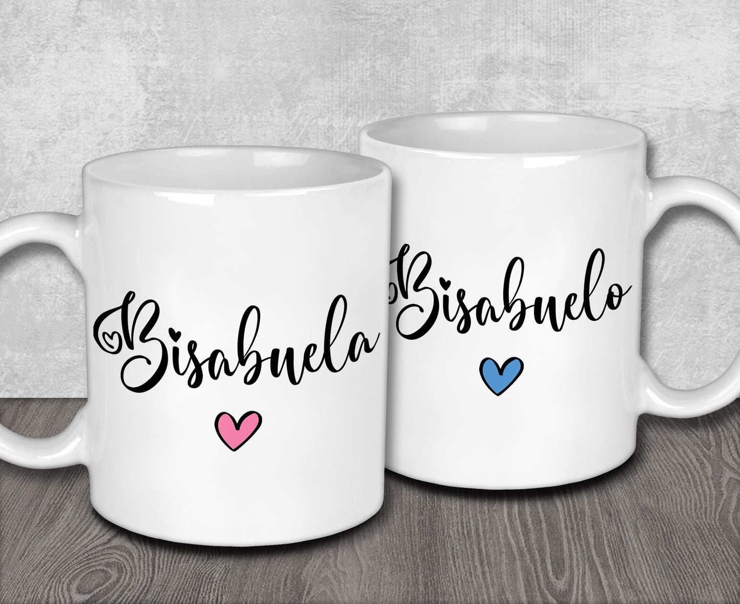 two white coffee mugs sitting on top of a wooden table