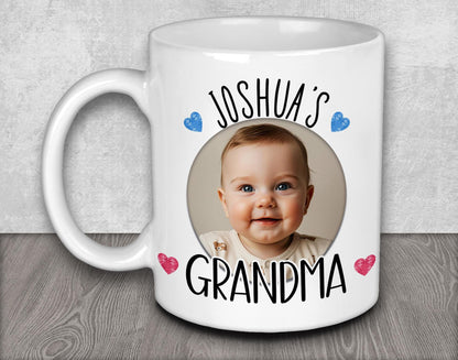 a white coffee mug with a picture of a baby on it