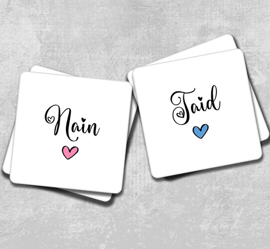 two coasters with the word main and a heart