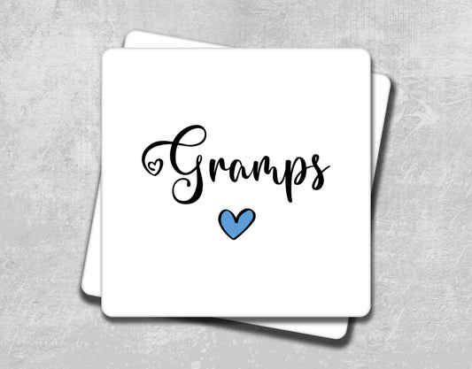 a square coaster with the word gumps on it