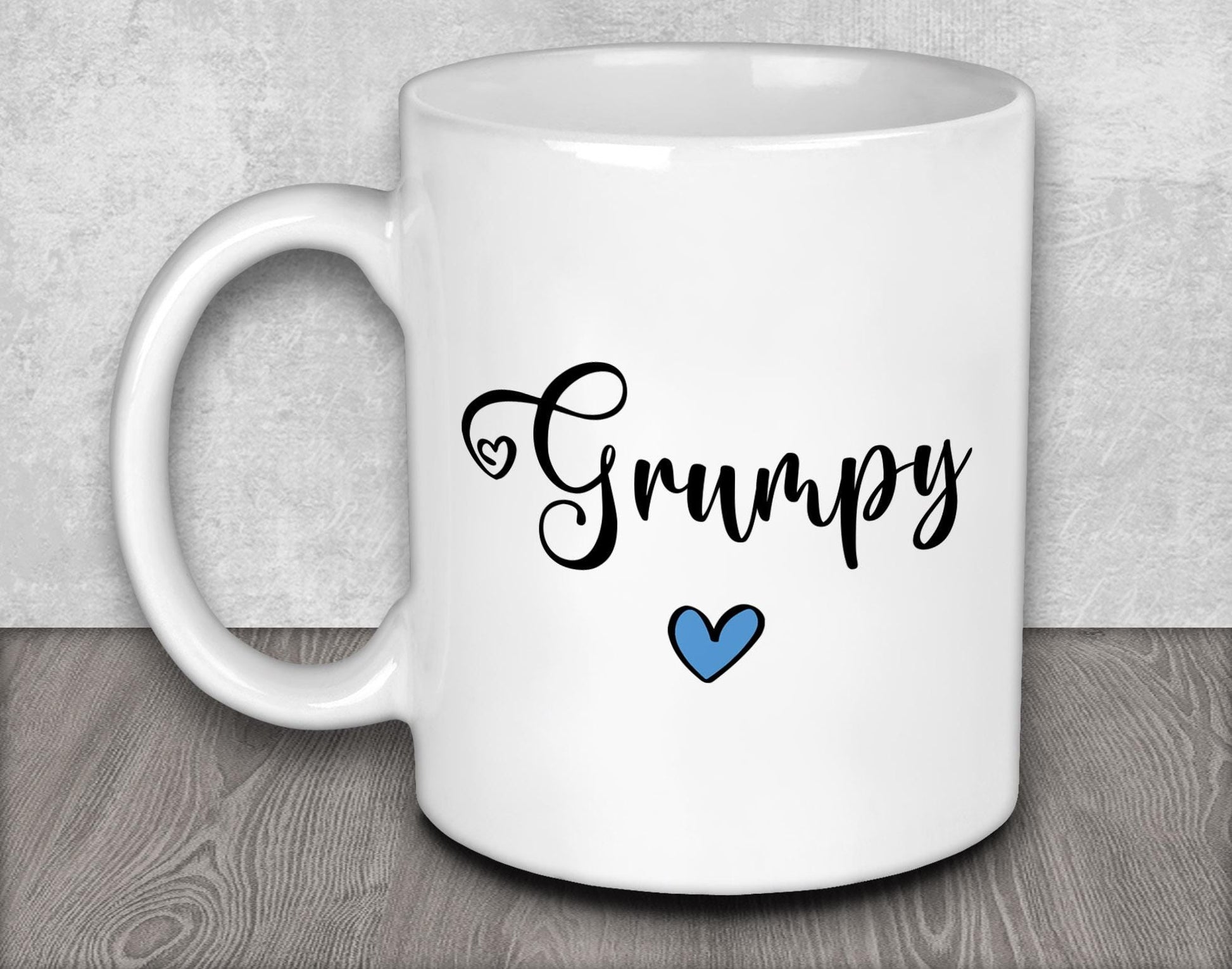 a white coffee mug with a blue heart on it
