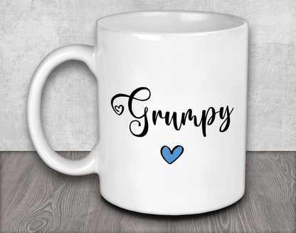 a white coffee mug with a blue heart on it