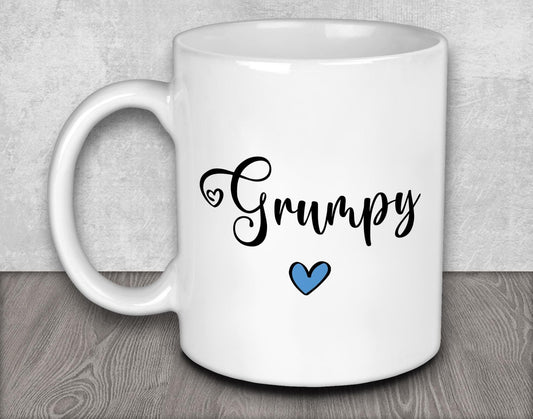a white coffee mug with a blue heart on it