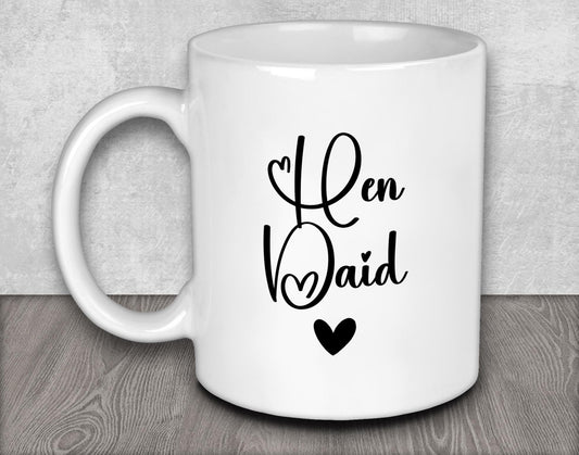a white coffee mug with a black heart on it