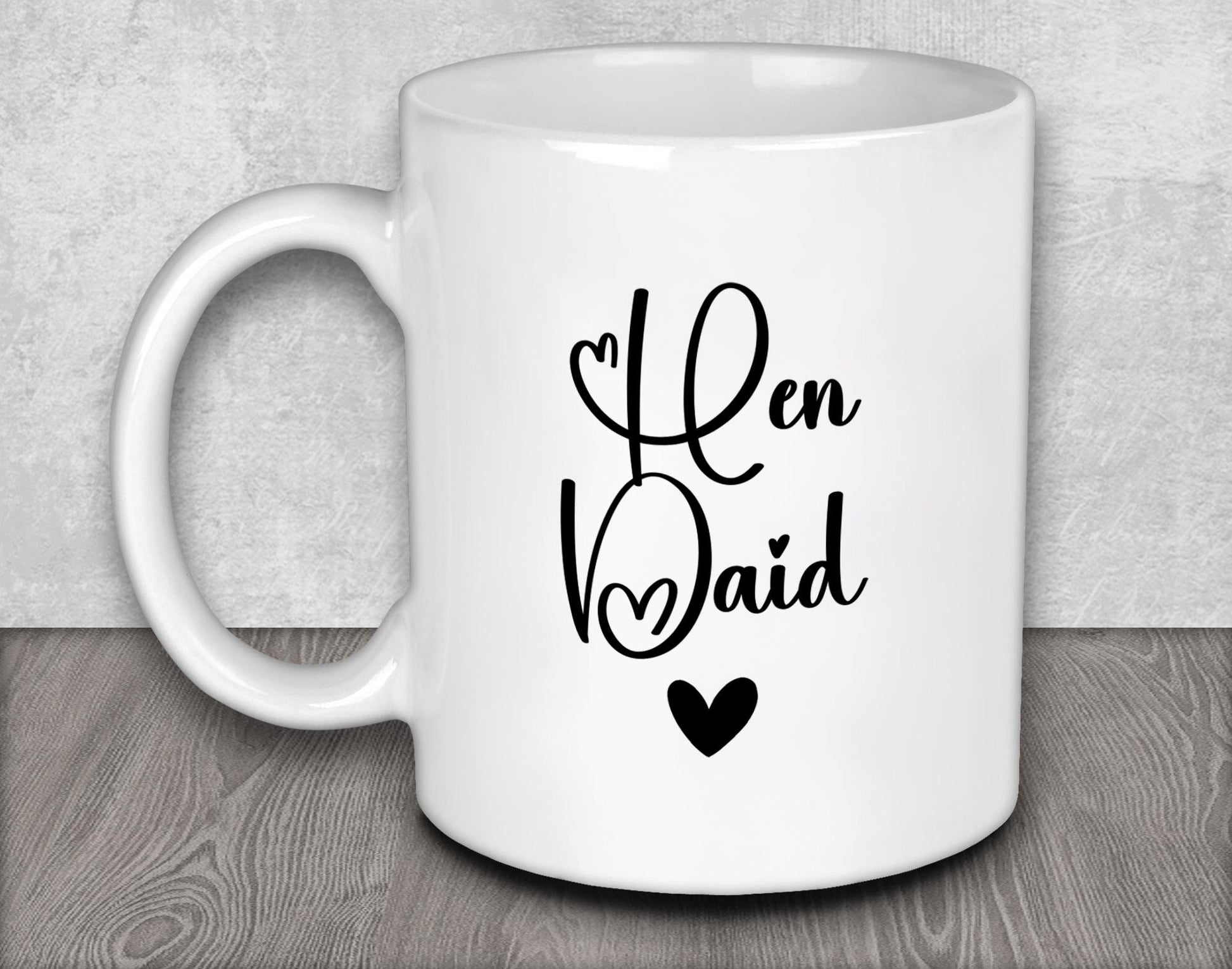 a white coffee mug with a black heart on it