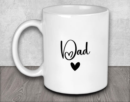 a white coffee mug with the word dad written on it