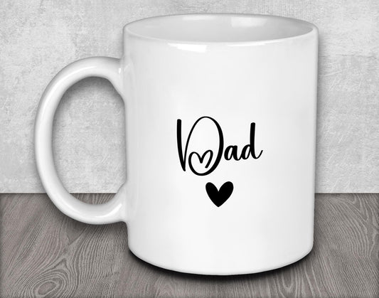 a white coffee mug with the word dad written on it