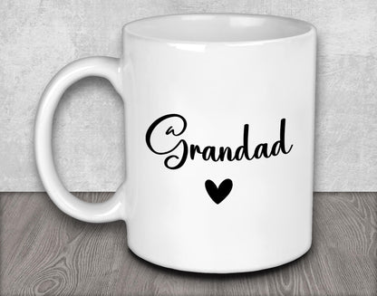 a white coffee mug with a black heart on it