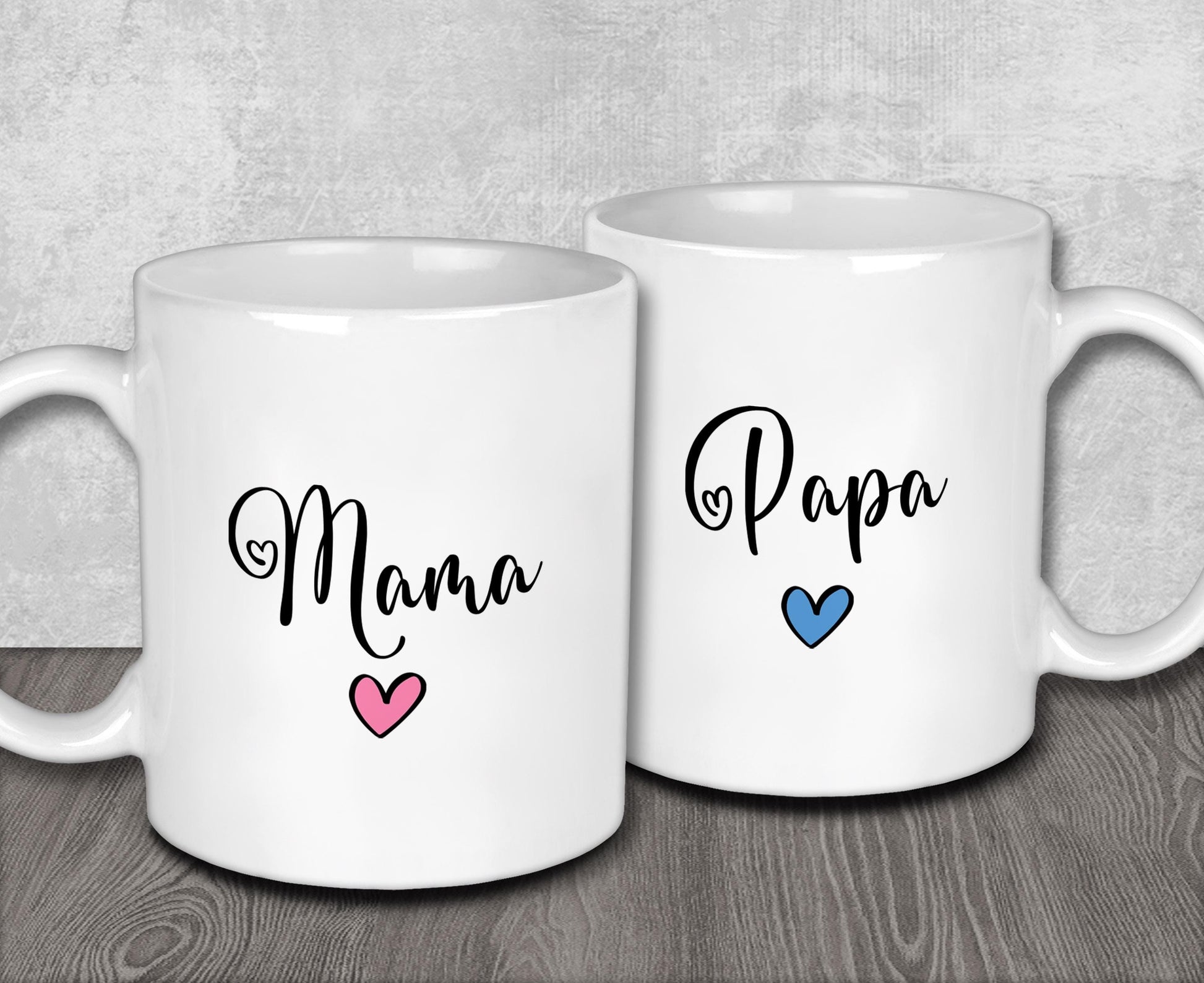 two white coffee mugs with the words mama and papa printed on them