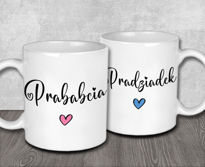 two white coffee mugs with the words prusaberia and hearts