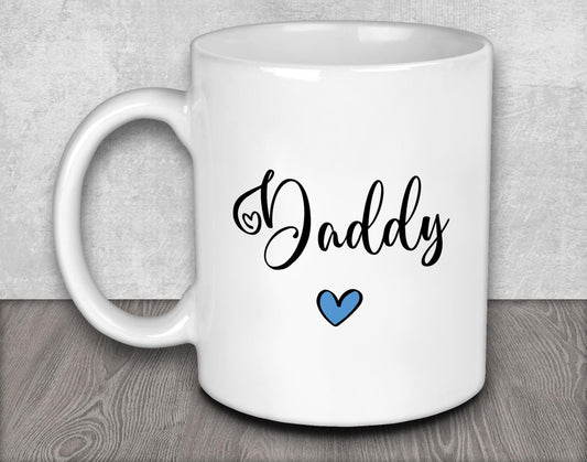 a white coffee mug with the word daddy on it