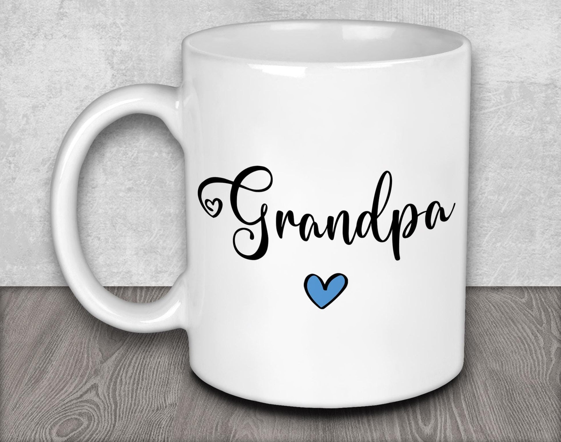 a white coffee mug with the word grandpa on it