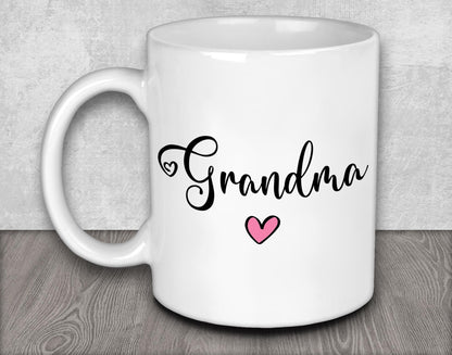 a white coffee mug with the word grandma on it