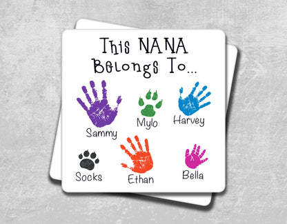 a coaster with hand prints on it that says, this nana belongs to