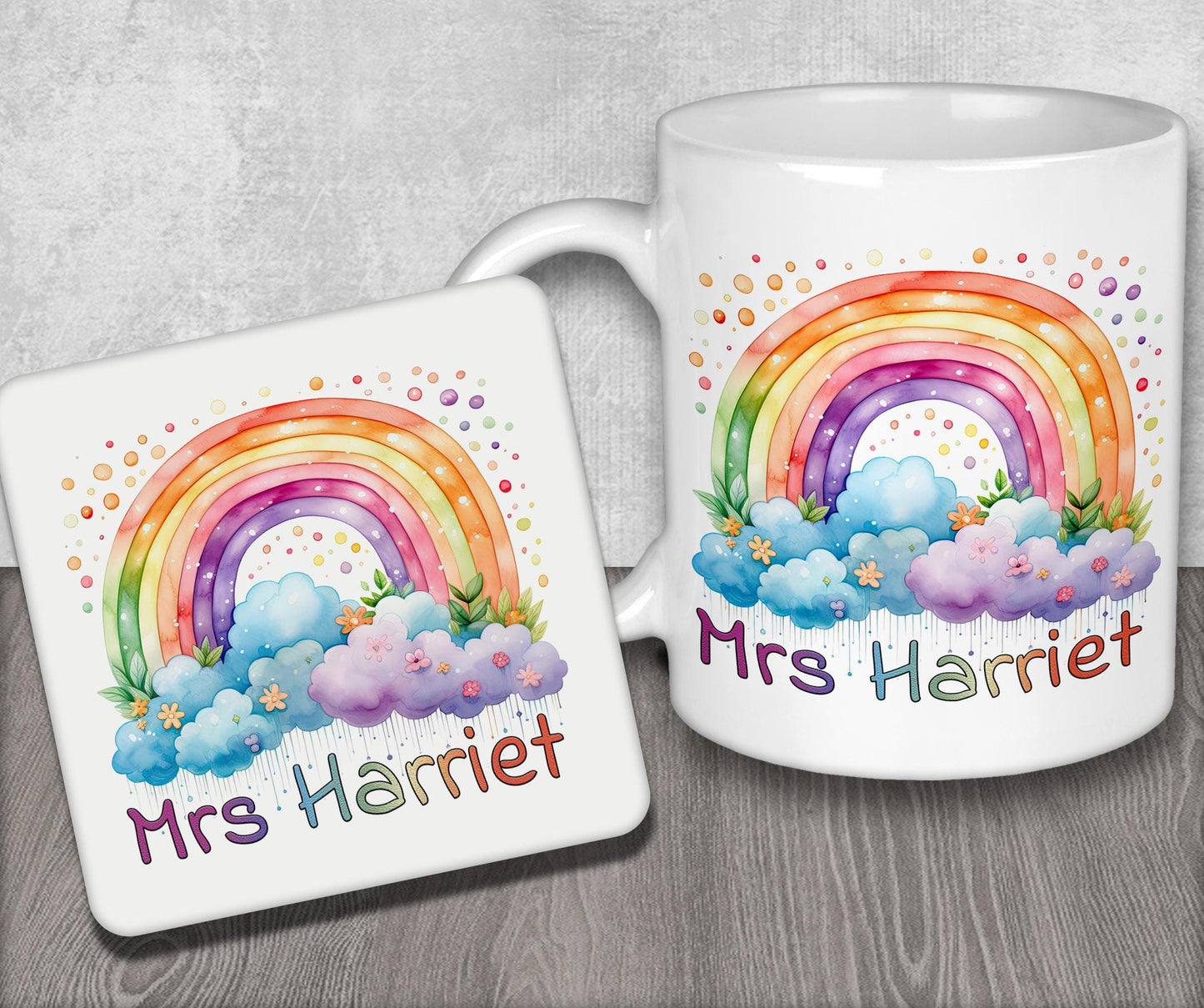 a couple of mugs with a rainbow on them