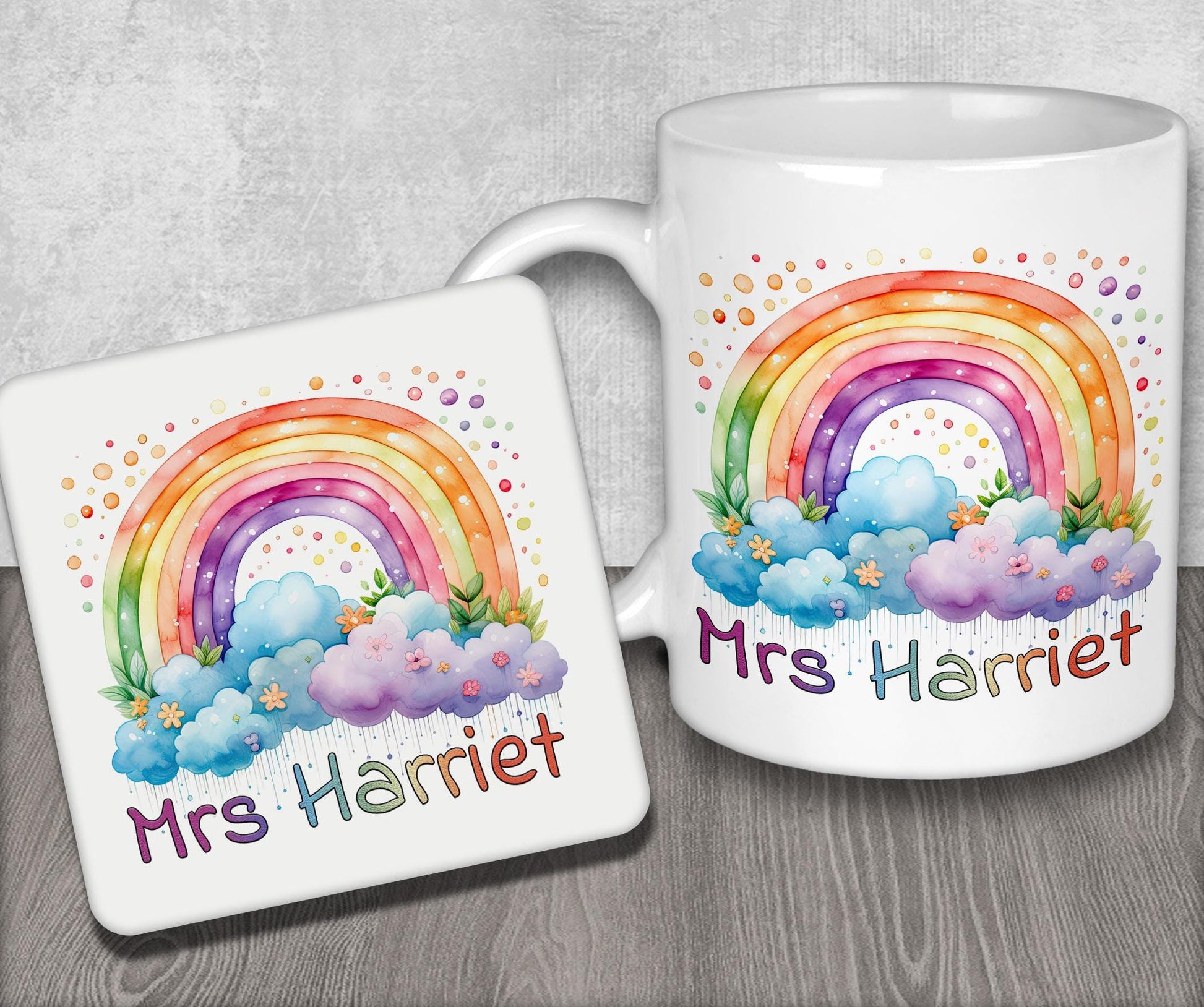 a couple of mugs with a rainbow on them