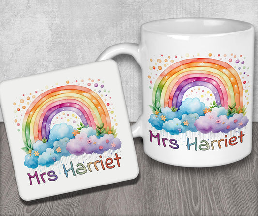 a couple of mugs with a rainbow on them