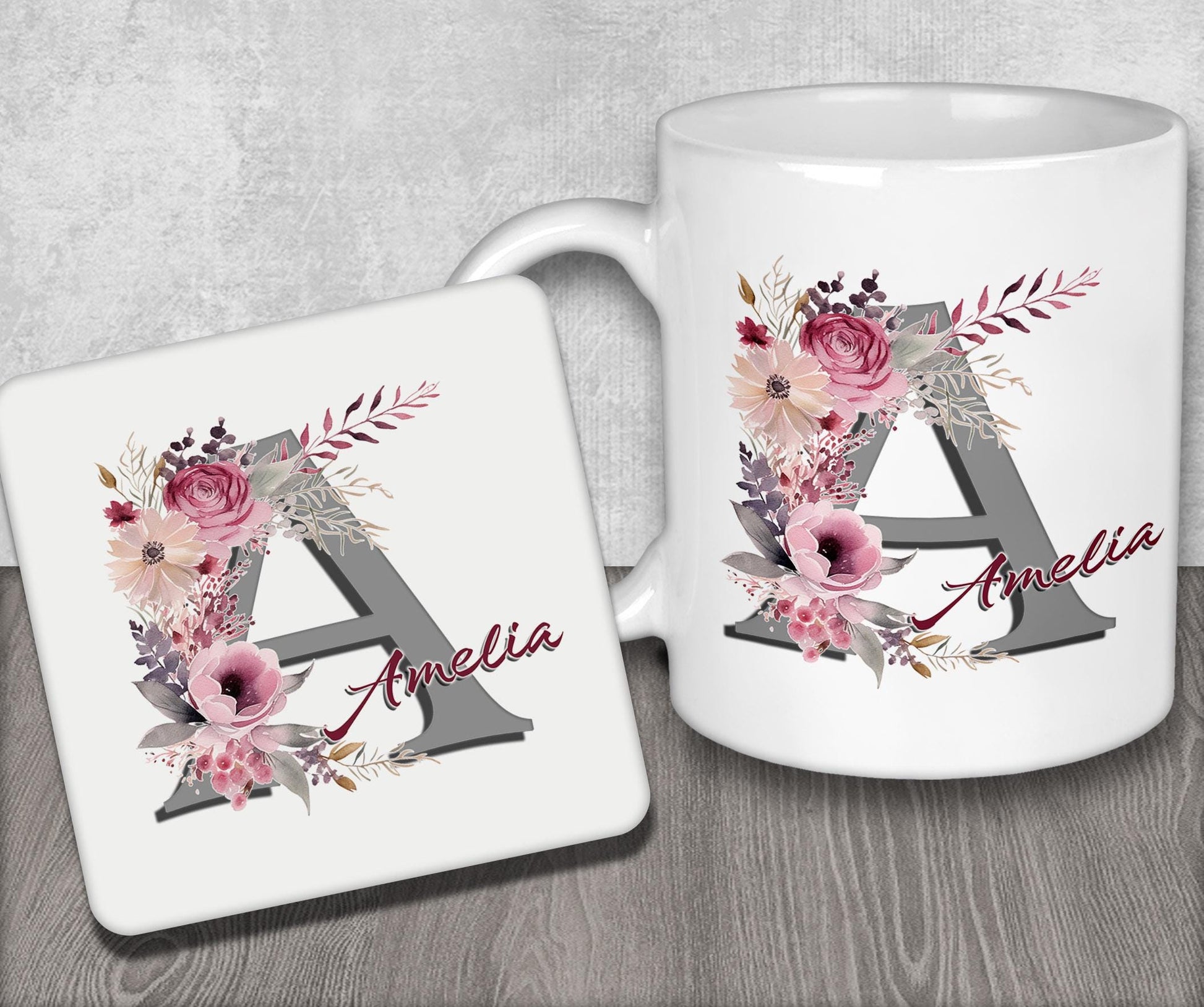 a white coffee mug with a floral monogrammed initial