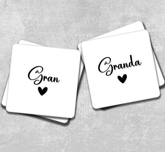 two square coasters with the words grand and grand written on them