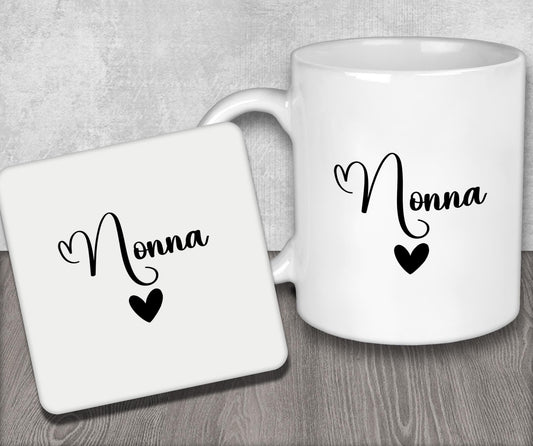 a white coffee mug sitting next to a coaster