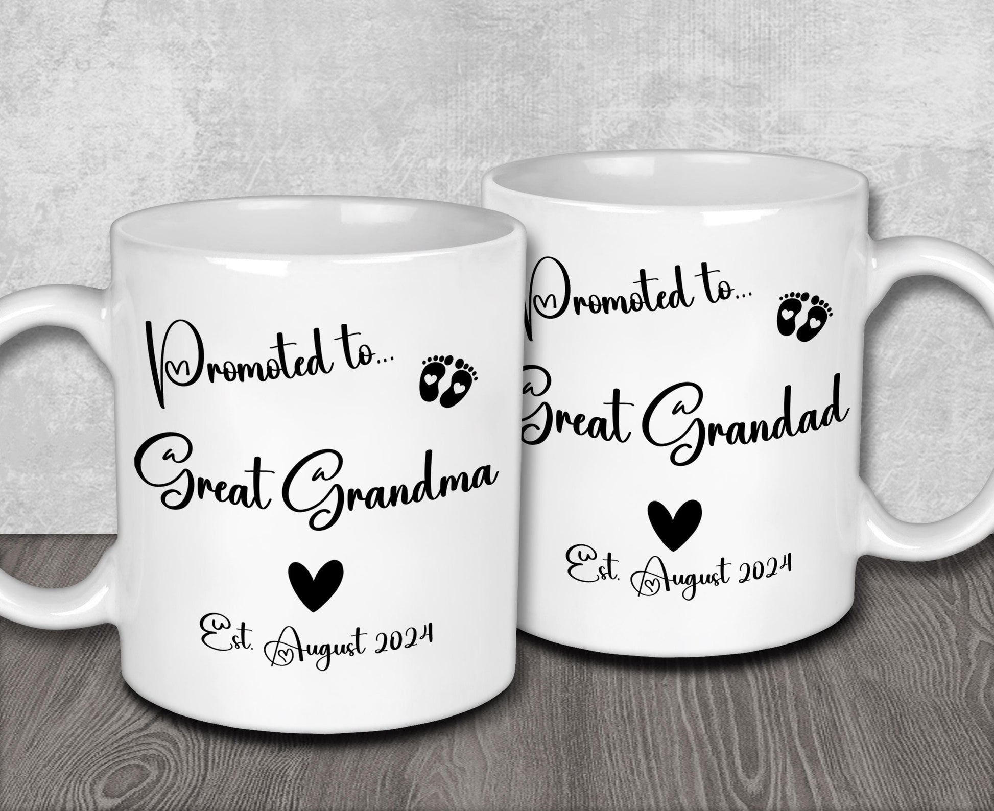 two white coffee mugs sitting on top of a wooden table